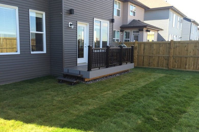 Small trendy backyard deck photo in Edmonton