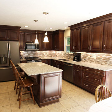 Waypoint Cherry Chocolate Cabinets and Giallo Ornamental Granite Countertops