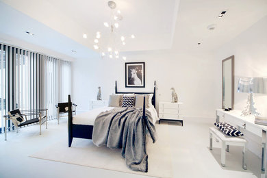 Design ideas for a contemporary master bedroom in London with white walls and white floor.