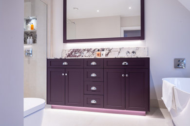 This is an example of a contemporary grey and purple bathroom in Surrey.