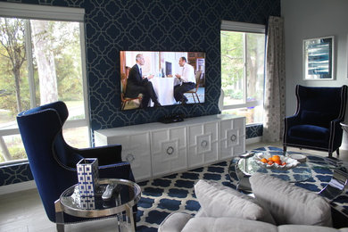 Inspiration for a mid-sized contemporary open concept vinyl floor and beige floor living room remodel in Orange County with gray walls, a wall-mounted tv and no fireplace