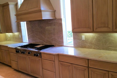 Kitchen - huge travertine floor and beige floor kitchen idea in Miami with a single-bowl sink, quartzite countertops, beige backsplash, stone slab backsplash and beige countertops