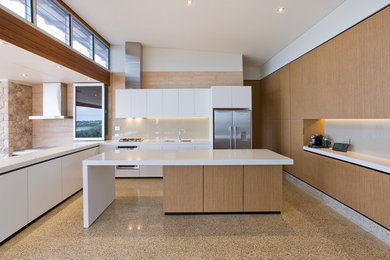 Photo of a large contemporary l-shaped open plan kitchen in Adelaide with a double-bowl sink, medium wood cabinets, quartz benchtops, beige splashback, metal splashback, stainless steel appliances and with island.