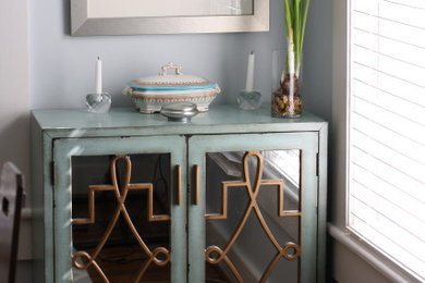Example of a transitional dining room design in Birmingham with blue walls