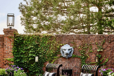 Patio - eclectic concrete paver patio idea in Omaha with no cover