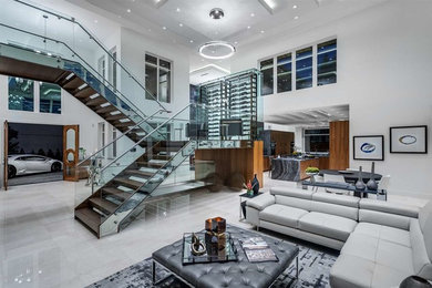 Example of a mid-sized minimalist wooden u-shaped open and glass railing staircase design in Vancouver