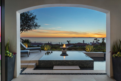 Mid-sized coastal exterior home idea in San Diego