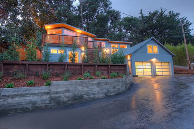 Large 1950s gray two-story stucco flat roof idea in San Francisco