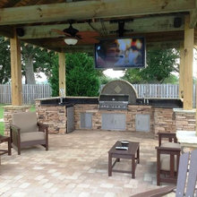 Ultimate Outdoor Man Cave with Mounted TV
