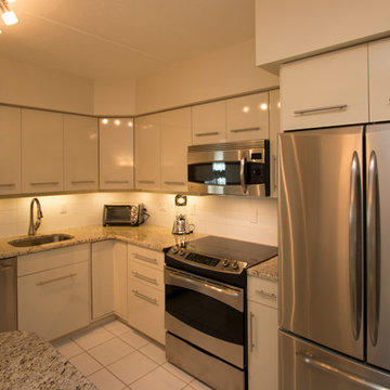 White Contemporary Kitchen with Brushed Nickel Hardware and Granite in Falls Chu