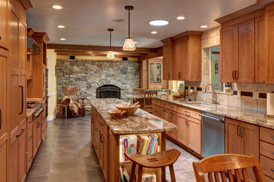 Enclosed kitchen - mid-sized transitional galley enclosed kitchen idea in Other with recessed-panel cabinets, medium tone wood cabinets, stainless steel appliances, an island, an undermount sink, beige backsplash and cement tile backsplash