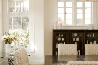 Inspiration for a mediterranean light wood floor dining room remodel in Atlanta with white walls and a standard fireplace