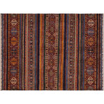 Bareens Designer Rugs - Khurgeen Carrie Blue/Red Wool Rug - 5'6'' x 7'9'' - Designed with a mesmerizing intricate transitional and geometric motif this glorious hand knotted rug made with handspun Ghazni wool is a masterpiece that will fill any space with sophistication and grace. Hand knotted by skilled artisans in an exhilarating color pallet with an elaborate design, this masterpiece features luxurious hand spun wool with all vegetable dyes to add comfort and style to your decor. The design, color, and beautiful chromatic composition with a sheen in transitional and geometric designs, exude beauty, elegance and quality make this rug an extraordinarily opulent center piece for your living space. The intricate designs known as Khurgeen, Khorgeen or Khorjin range are inspired by the patterns from ancient tribal bags. An infusion of bold, saturated color gives this traditional hand-knotted rug a fresh perspective and modern appeal. Most desired due to its versatility in design and affordability this handmade rug is in a compelling focal point in any living area.
