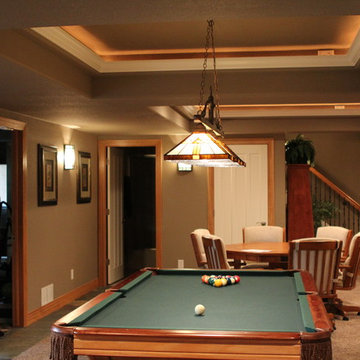 Eye-popping Denver Basement Remodel with hidden bookcase doors and tray ceilings