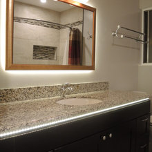 Bathroom w/LED backlight, large format tile, metal trim, shower niche