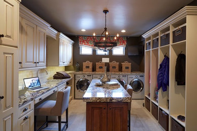 Inspiration for a large timeless porcelain tile dedicated laundry room remodel in Denver with an undermount sink, raised-panel cabinets and a side-by-side washer/dryer