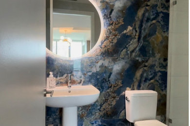 Inspiration for a small contemporary shower room bathroom with a walk-in shower, a two-piece toilet, blue tiles, porcelain tiles, blue walls, vinyl flooring, a pedestal sink, grey floors, a hinged door and a single sink.