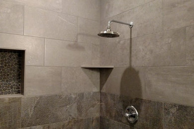 Example of a mountain style master gray tile and porcelain tile bathroom design in Seattle with tile countertops