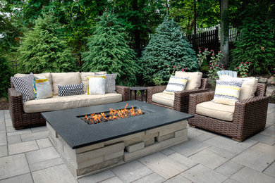 Patio - small traditional backyard concrete paver patio idea in New York with a fire pit