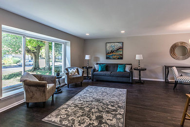 Inspiration for a large transitional formal and open concept dark wood floor living room remodel in Detroit with beige walls, no fireplace and no tv