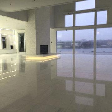 White Thassos Split Face Fireplace With Bianco Dolomite Floor.