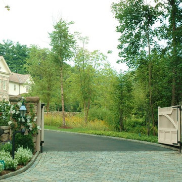 Driveway entrance with wildflower meadow alongside