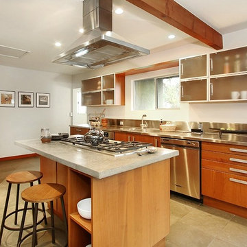 Warm Modern Kitchen With Stainless Steel Counter, Concrete Island Top and Counte