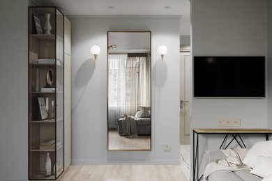 Diseño de dormitorio contemporáneo de tamaño medio con paredes verdes y suelo de madera en tonos medios