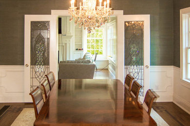Mid-sized elegant medium tone wood floor kitchen/dining room combo photo in Louisville with green walls