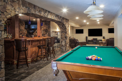 Example of a large transitional walk-out porcelain tile basement design in Other with gray walls