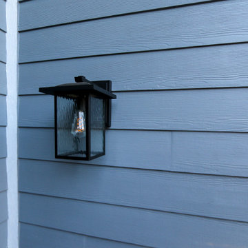 Home Exterior Siding Front Door with Black Lantern Light