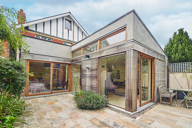 Photo of a contemporary courtyard patio in Dublin with natural stone pavers.
