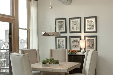 Example of a mid-sized trendy dark wood floor and brown floor kitchen/dining room combo design with gray walls