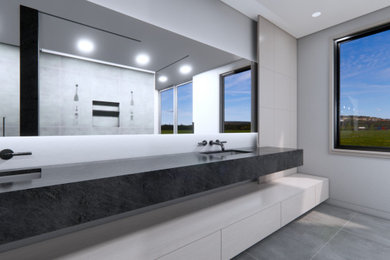 Inspiration for a gray tile and porcelain tile gray floor and double-sink double shower remodel in Chicago with flat-panel cabinets, light wood cabinets, gray walls, an integrated sink, soapstone countertops, a hinged shower door, a floating vanity and black countertops