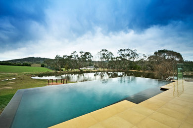 This is an example of a mid-sized contemporary pool in Melbourne.