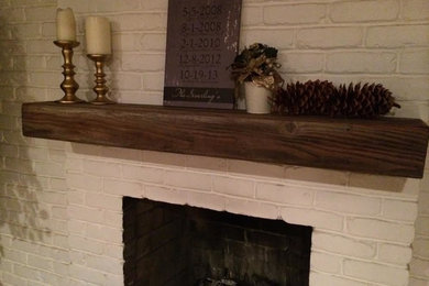 Elegant living room photo in Sacramento with a standard fireplace and a brick fireplace