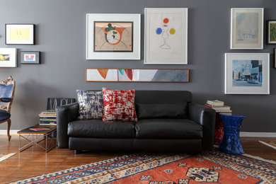 Inspiration for a small eclectic enclosed living room in Other with grey walls.