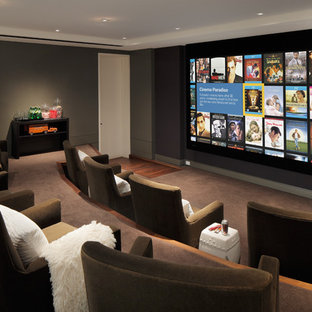 Contemporary home cinema in San Francisco with brown floors.
