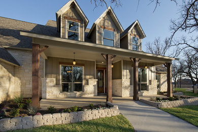 Mid-sized traditional beige two-story mixed siding exterior home idea in Houston with a shingle roof