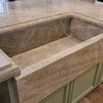 Victoria Falls & Ice Flakes countertops with stone farm sink