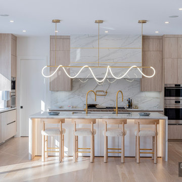 Sculptural Serenity: Dual-Faucet Marble Kitchen in Newton