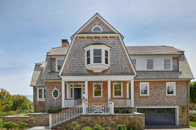 Beach style beige three-story wood and shingle house exterior photo in Providence with a gambrel roof, a shingle roof and a gray roof
