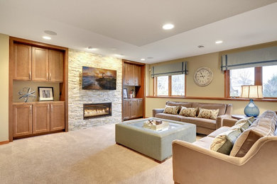 Design ideas for a mid-sized transitional open concept family room in Minneapolis with a home bar, beige walls, carpet, a ribbon fireplace, a stone fireplace surround, a wall-mounted tv and beige floor.