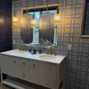 Ceiling-Hung Rectangles and Pendants Above a Long Oak Vanity