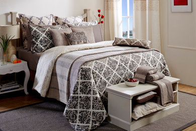Bedroom - large modern master medium tone wood floor bedroom idea in Toronto with white walls and no fireplace