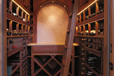 Photo of a small traditional wine cellar in San Francisco with storage racks.