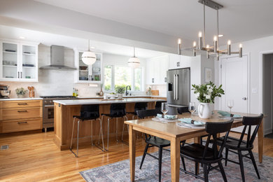 Inspiration for a large transitional light wood floor and brown floor kitchen/dining room combo remodel in Detroit with white walls