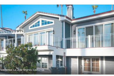 Inspiration for a large coastal two-story exterior home remodel in San Diego