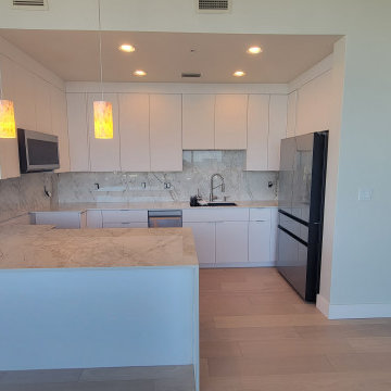 Modern Kitchen Remodel Done in New Glossy White Cabinets