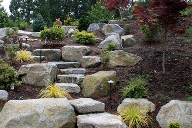 Contemporary front yard full sun formal garden in Seattle with a garden path and natural stone pavers.